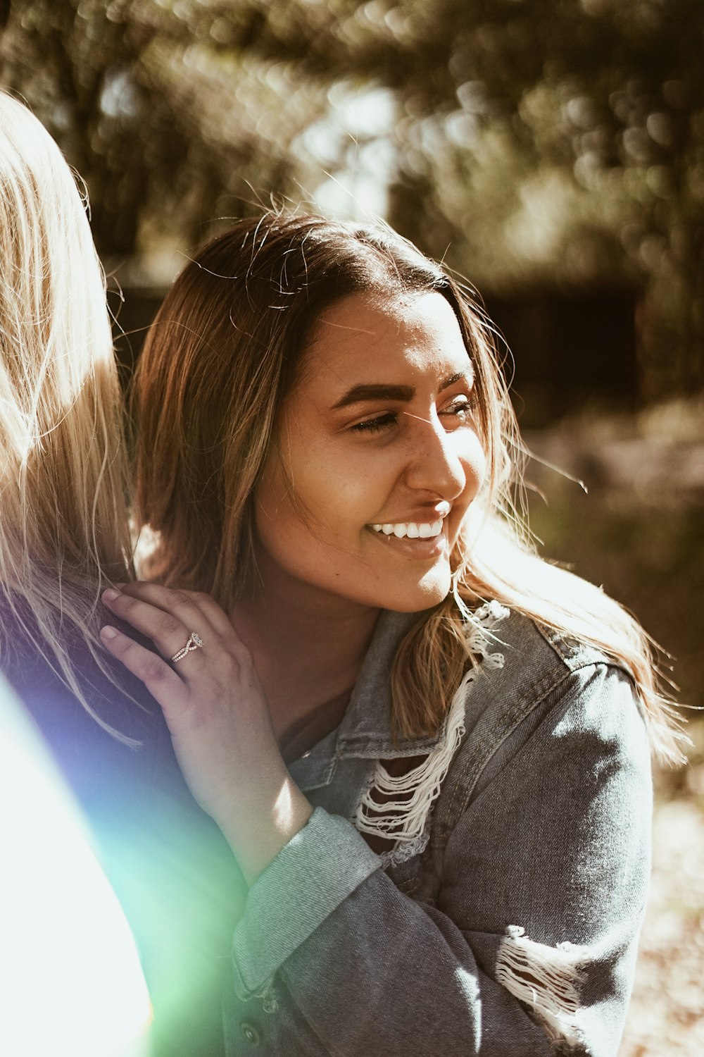 woman in blue denim jeans smiling