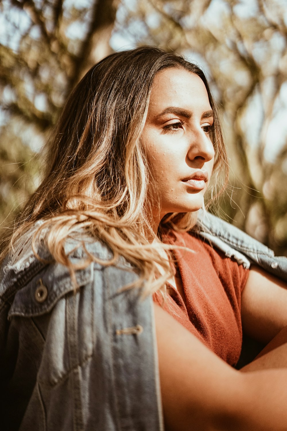 woman wearing blue denim jacket