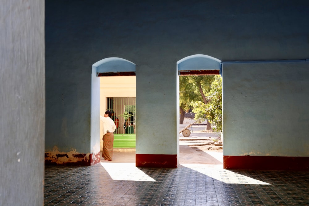 man standing beside door