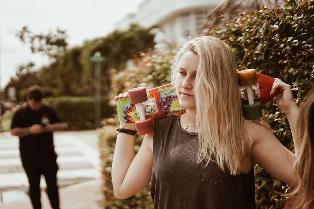 woman holding longboard