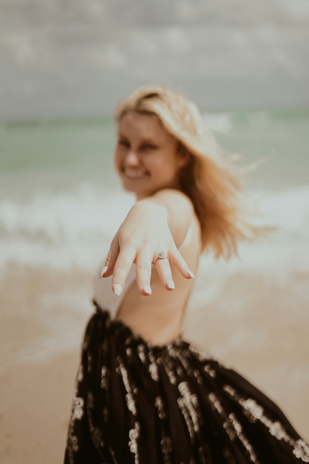 woman showing silver-colored ring