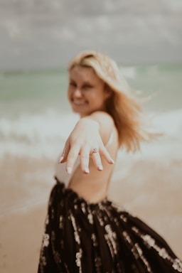 the ring,how to photograph woman showing silver-colored ring