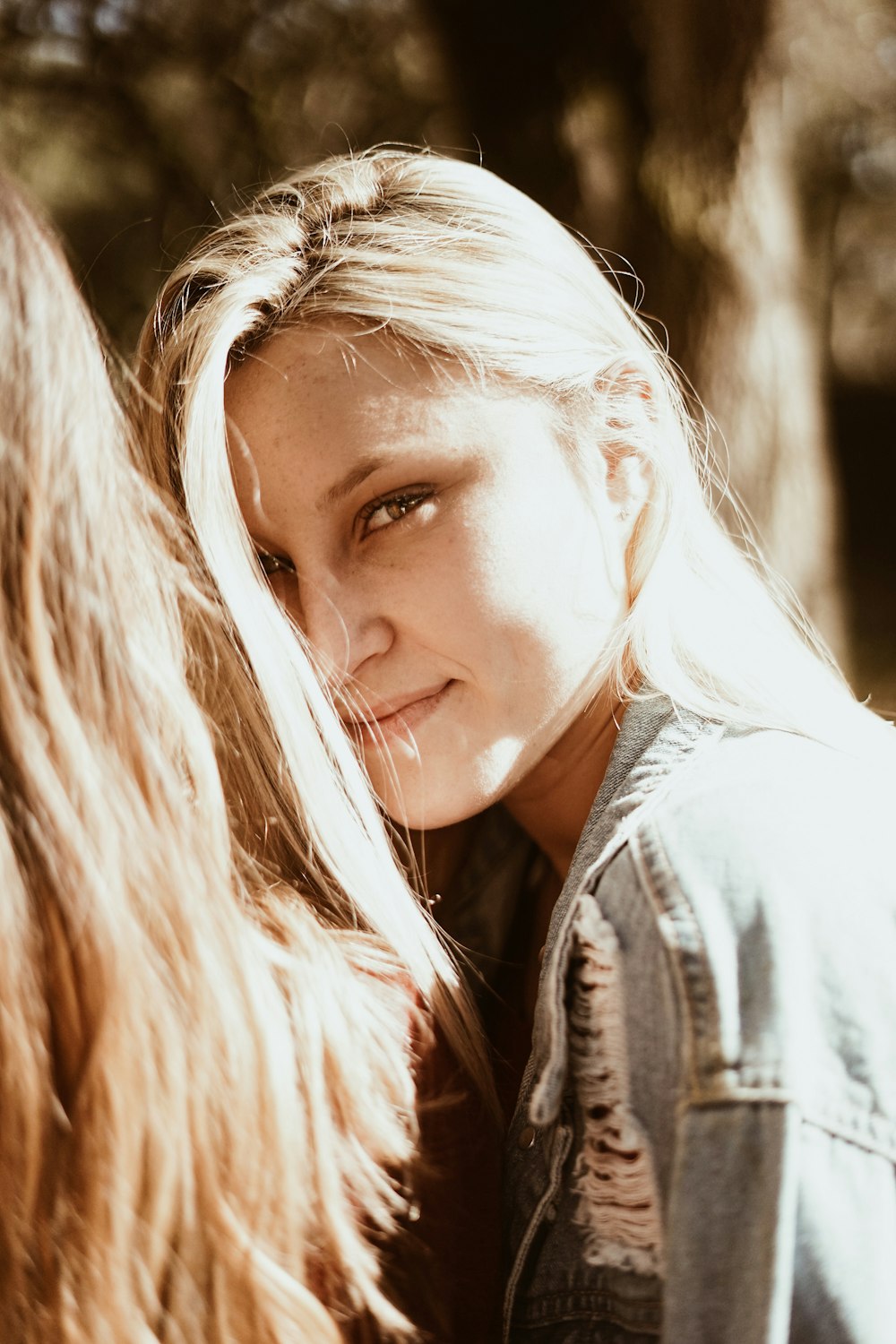 woman wearing blue denim jacket