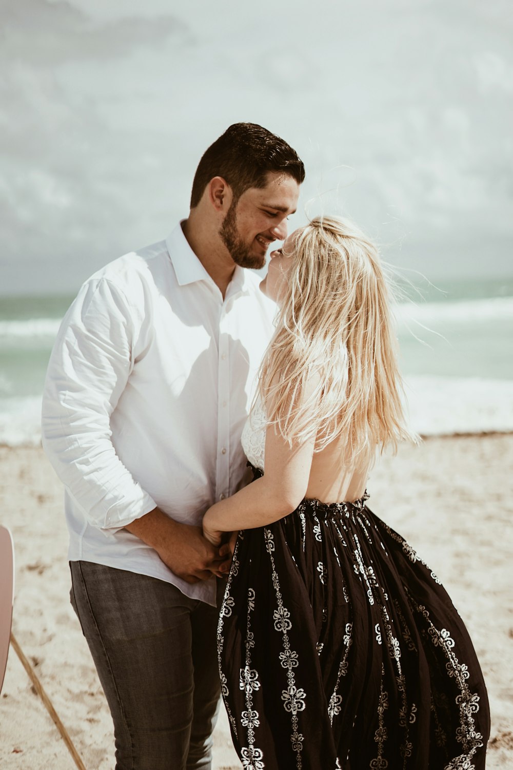 couple holding each other hands