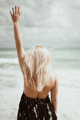 the ring,how to photograph woman standing and raising left hand