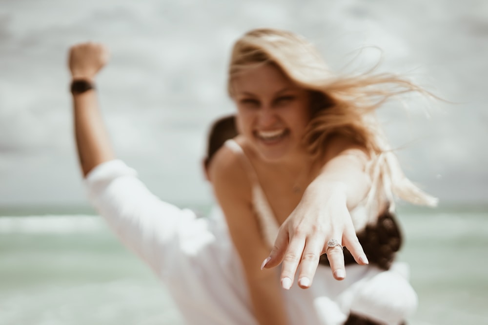 man carrying woman