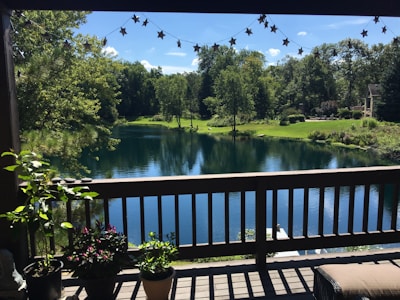 Backyard view showing a large deck and garden space.