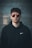 man standing wearing black Nike hoodie