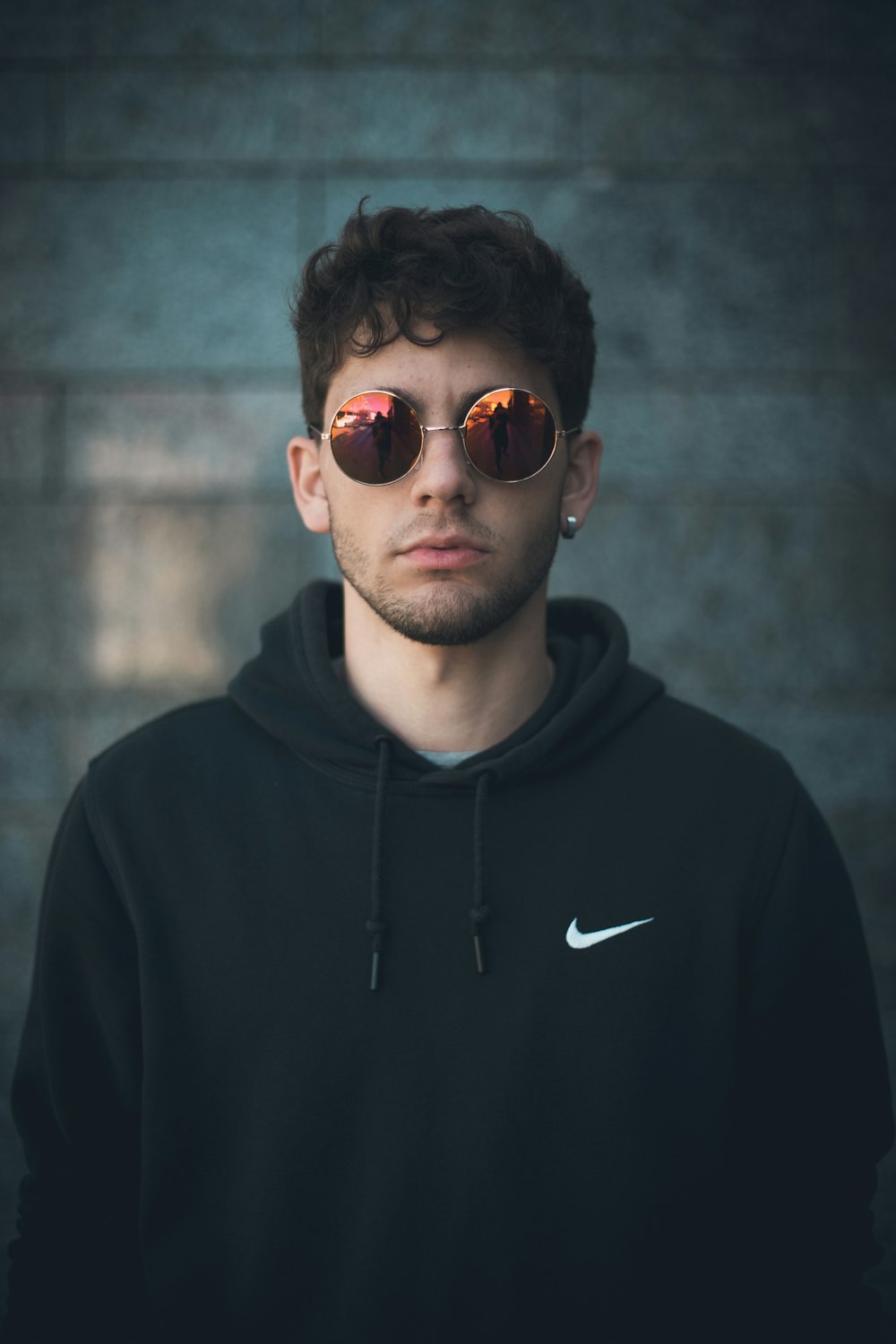 man standing wearing black Nike hoodie photo – Free Sunglasses Image on  Unsplash