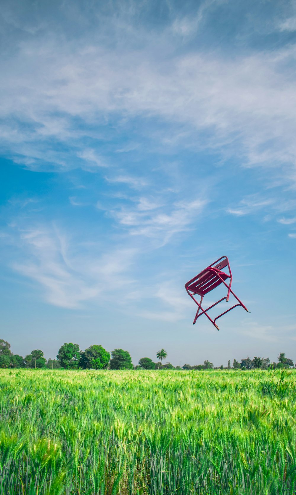 red chair throw over the grass