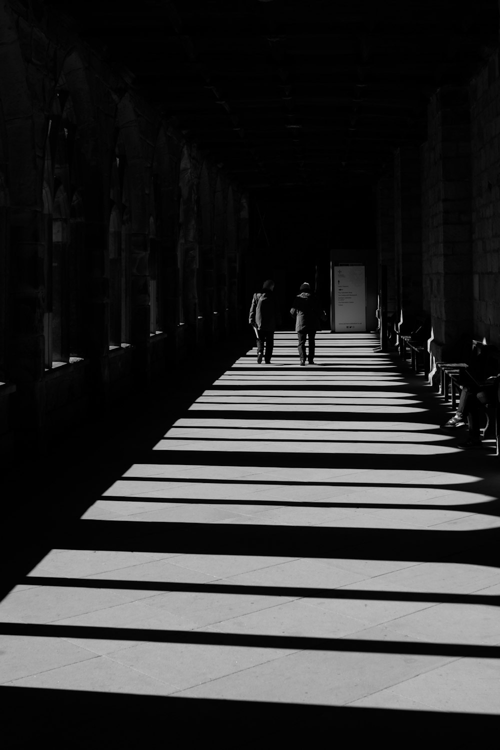 two men walking in a corridor