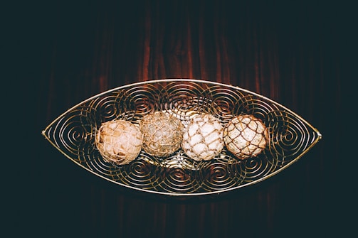 Set of decorative vime trays arranged on a rustic wooden surface.