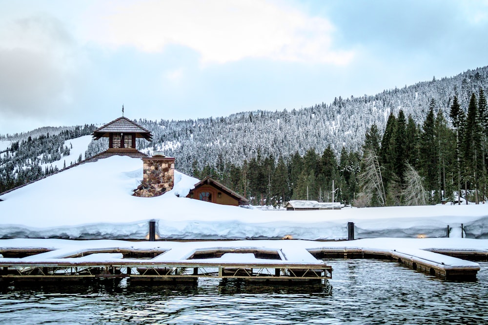 snow covered dock on the water