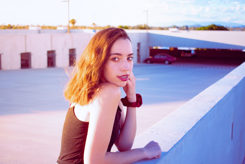 shallow focus photo of woman in black sleeveless shirt