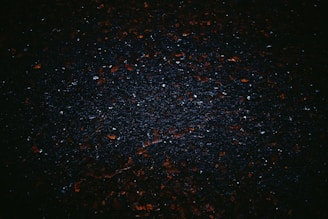 a black background with small red and white speckles