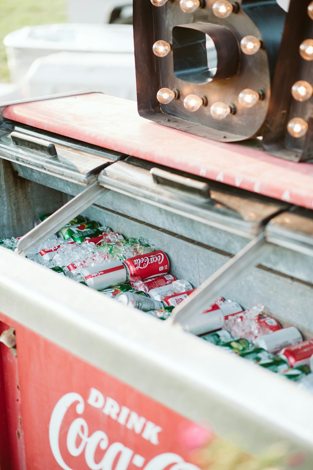 white and red Coca-Cola deep freezer