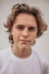 smiling man in white crew-neck shirt