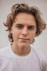 smiling man in white crew-neck shirt