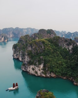 boat sailing near island