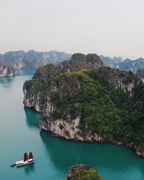 boat sailing near island