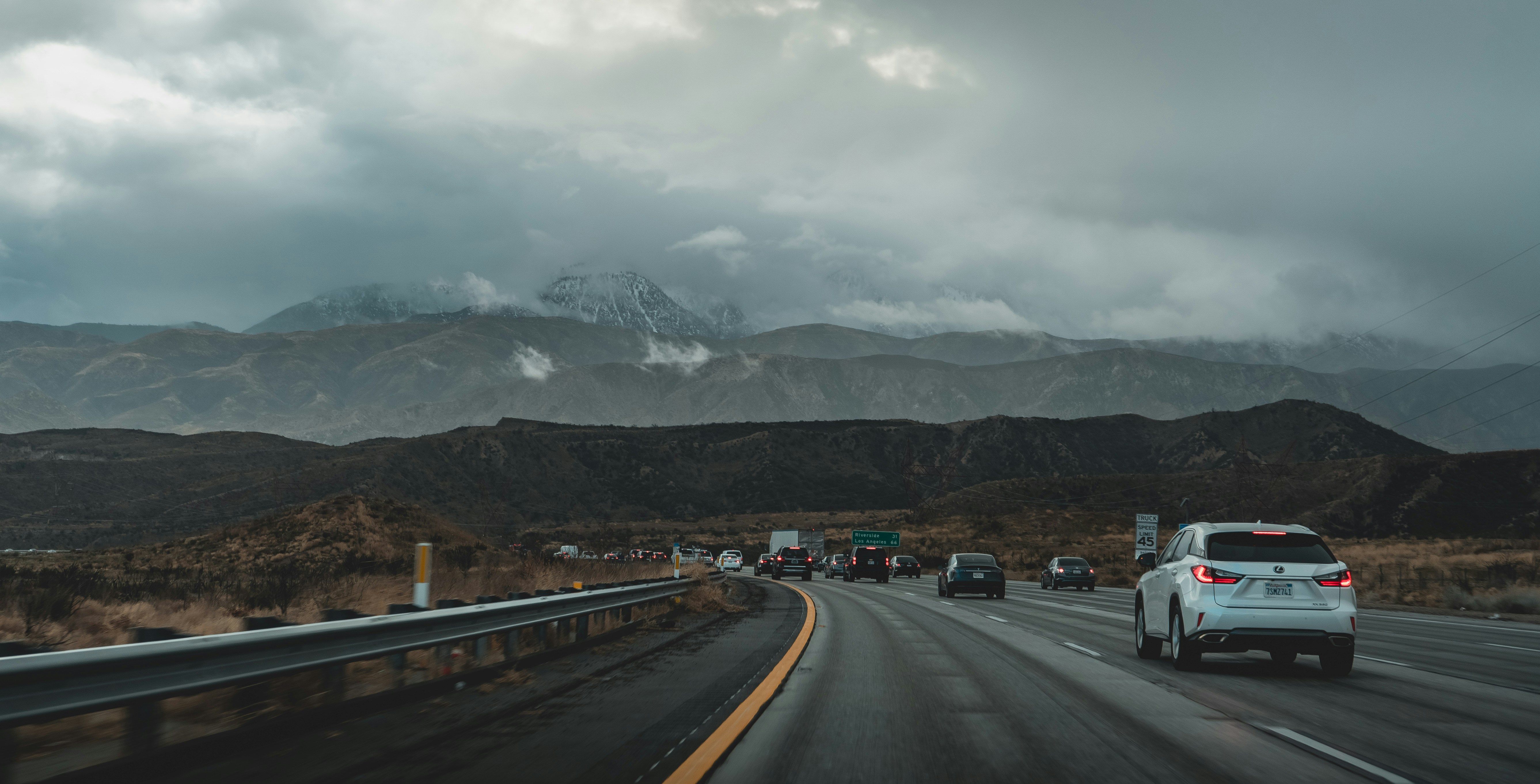 white vehicle at road during daytime