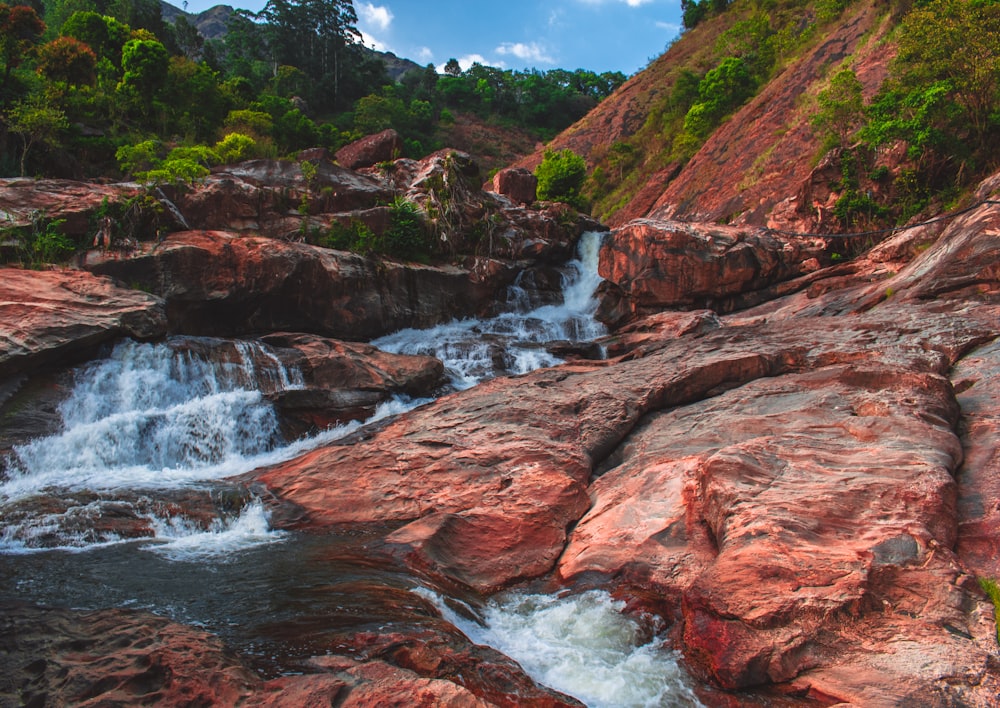 river and brown rocks during daytime