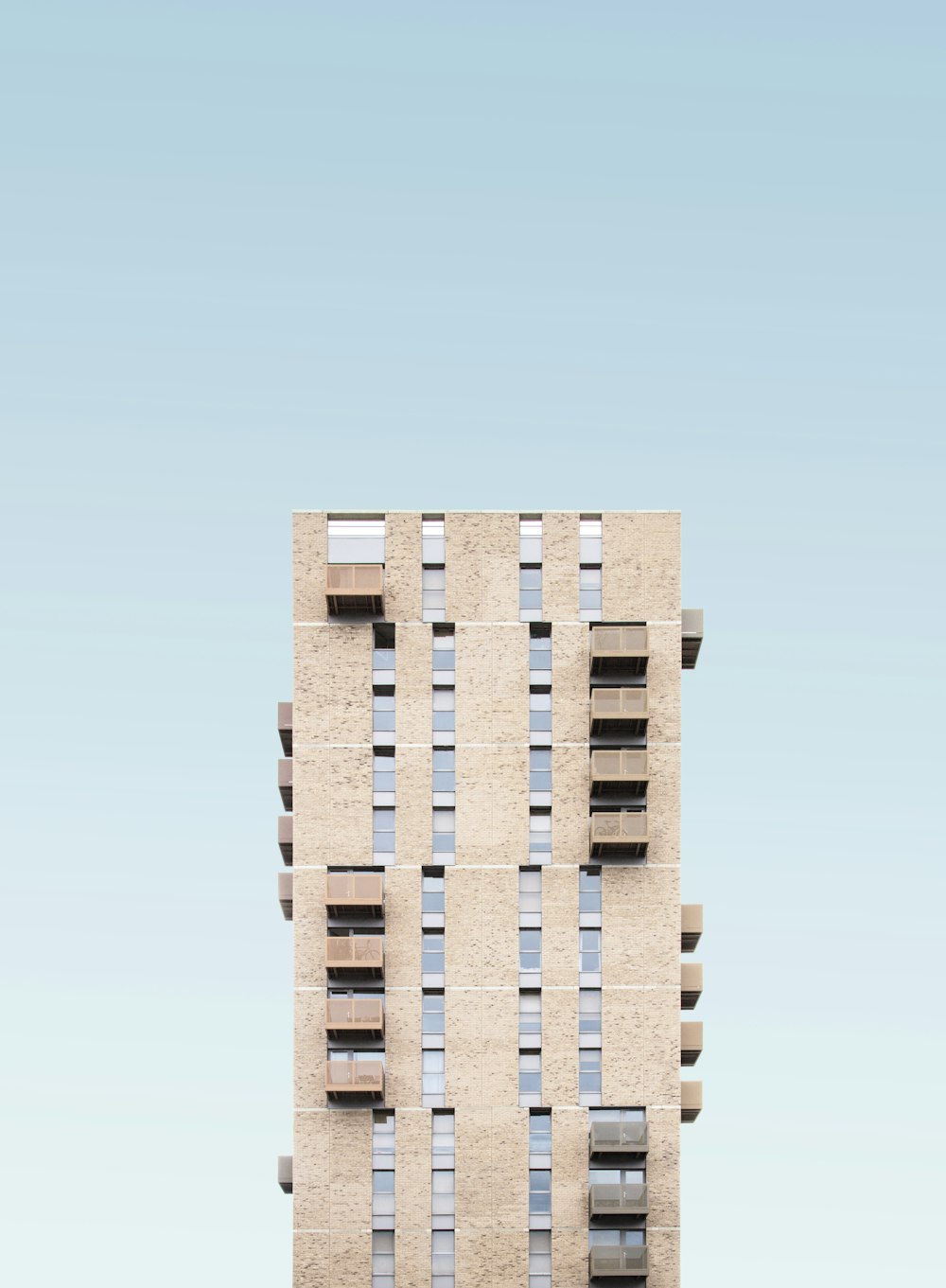 beige concrete high-rise building