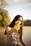 woman holding yellow flower during daytime