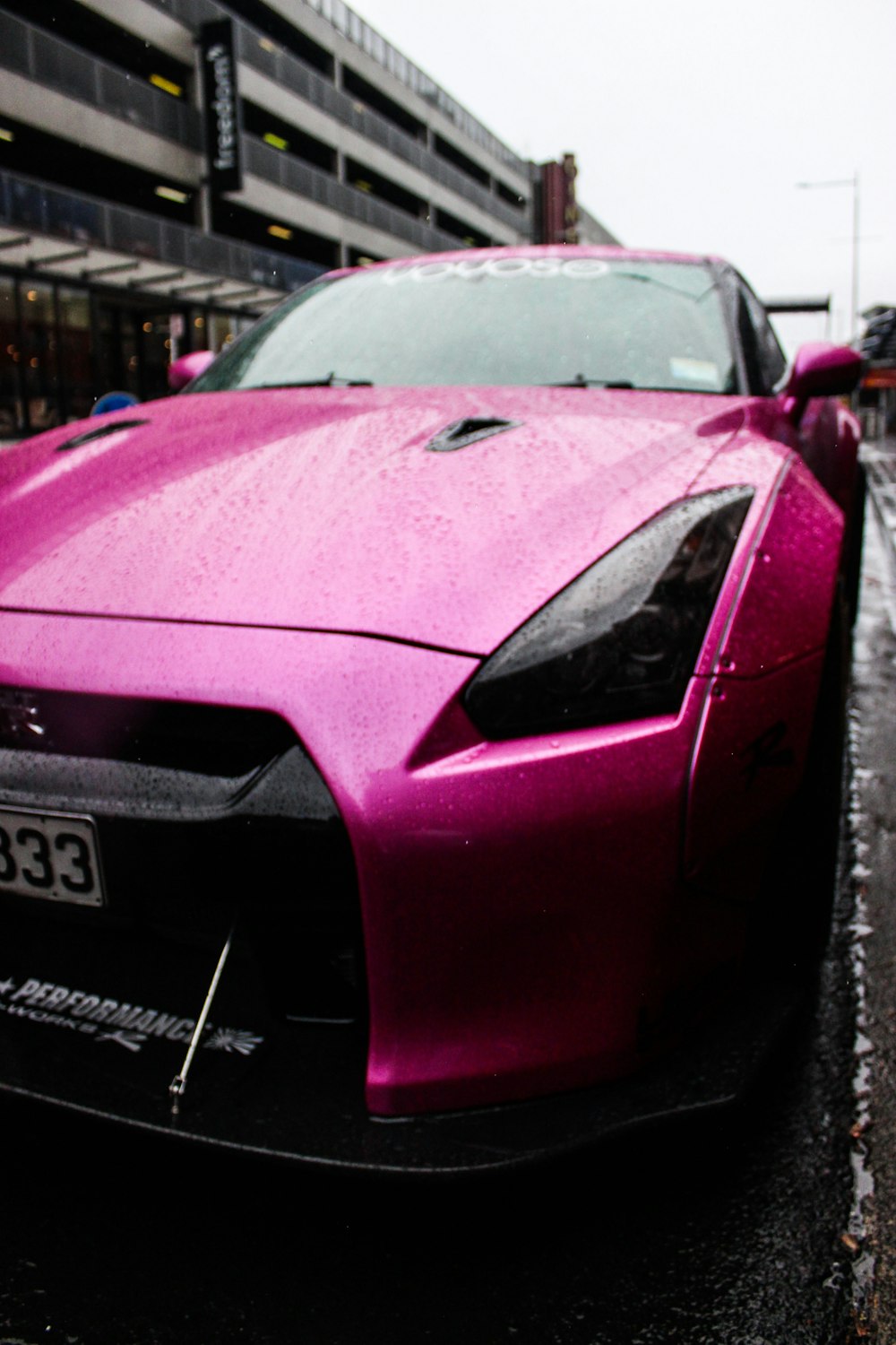 shallow focus photo of pink car