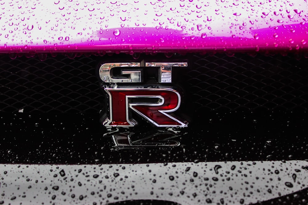 a close up of a car with rain drops on it