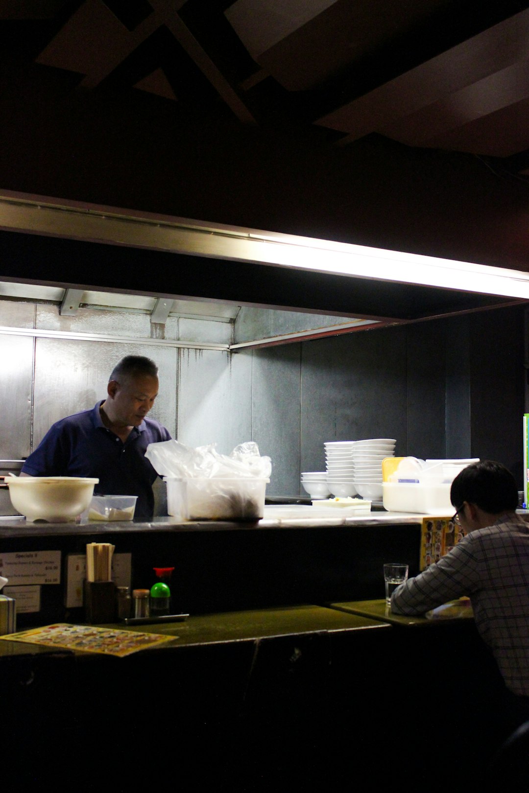 man sitting and eating inside building