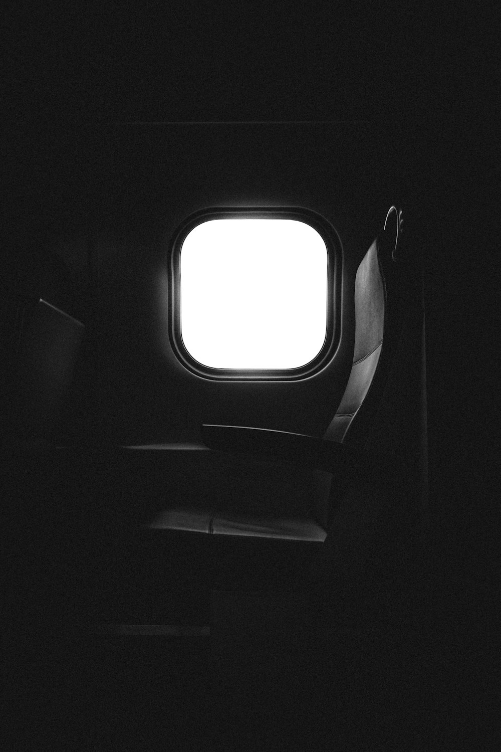 window of an airplane with a seat