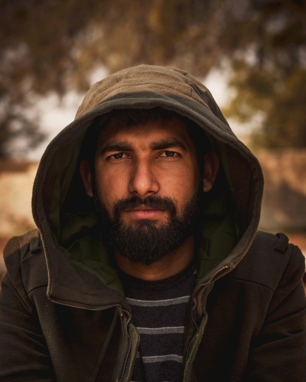 man wearing black hooded jacket