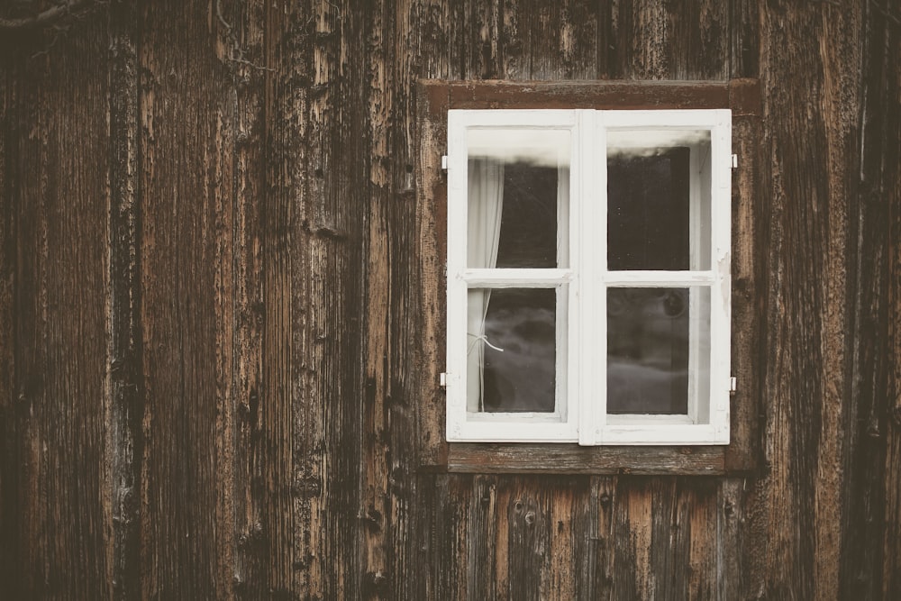 white wooden clear glass window sash