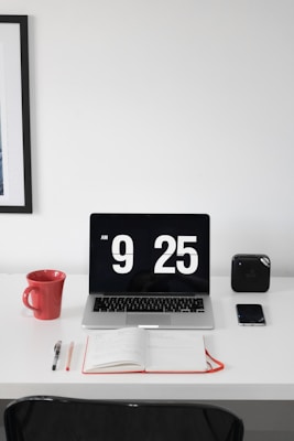 black and gray laptop on white surface