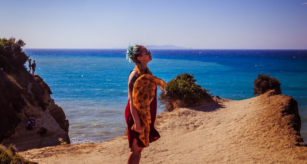 woman standing on cliff