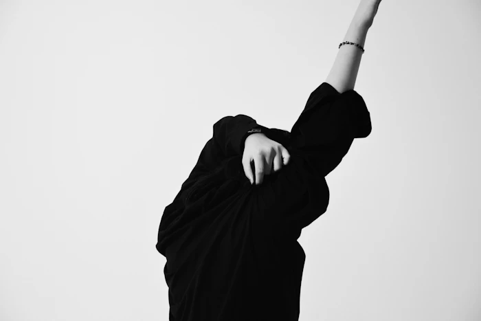 Black and white portrait of a model in a black shirt