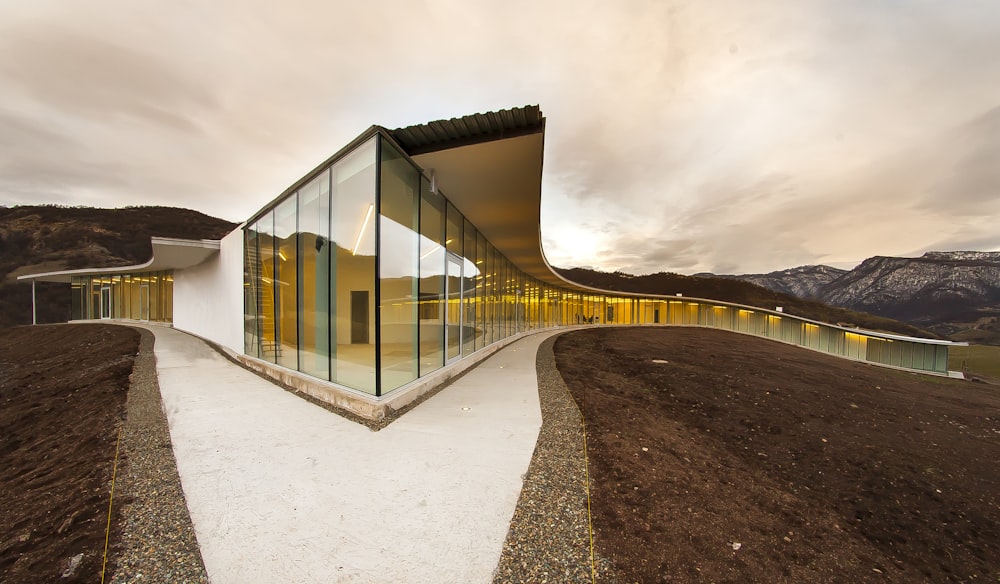 clear glass panel building under cloudy during daytime