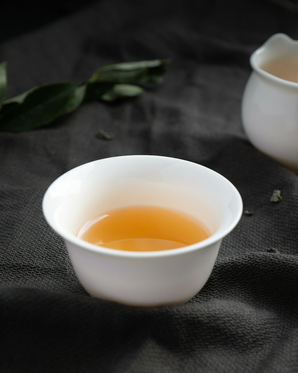 white ceramic bowl with yellow liquid