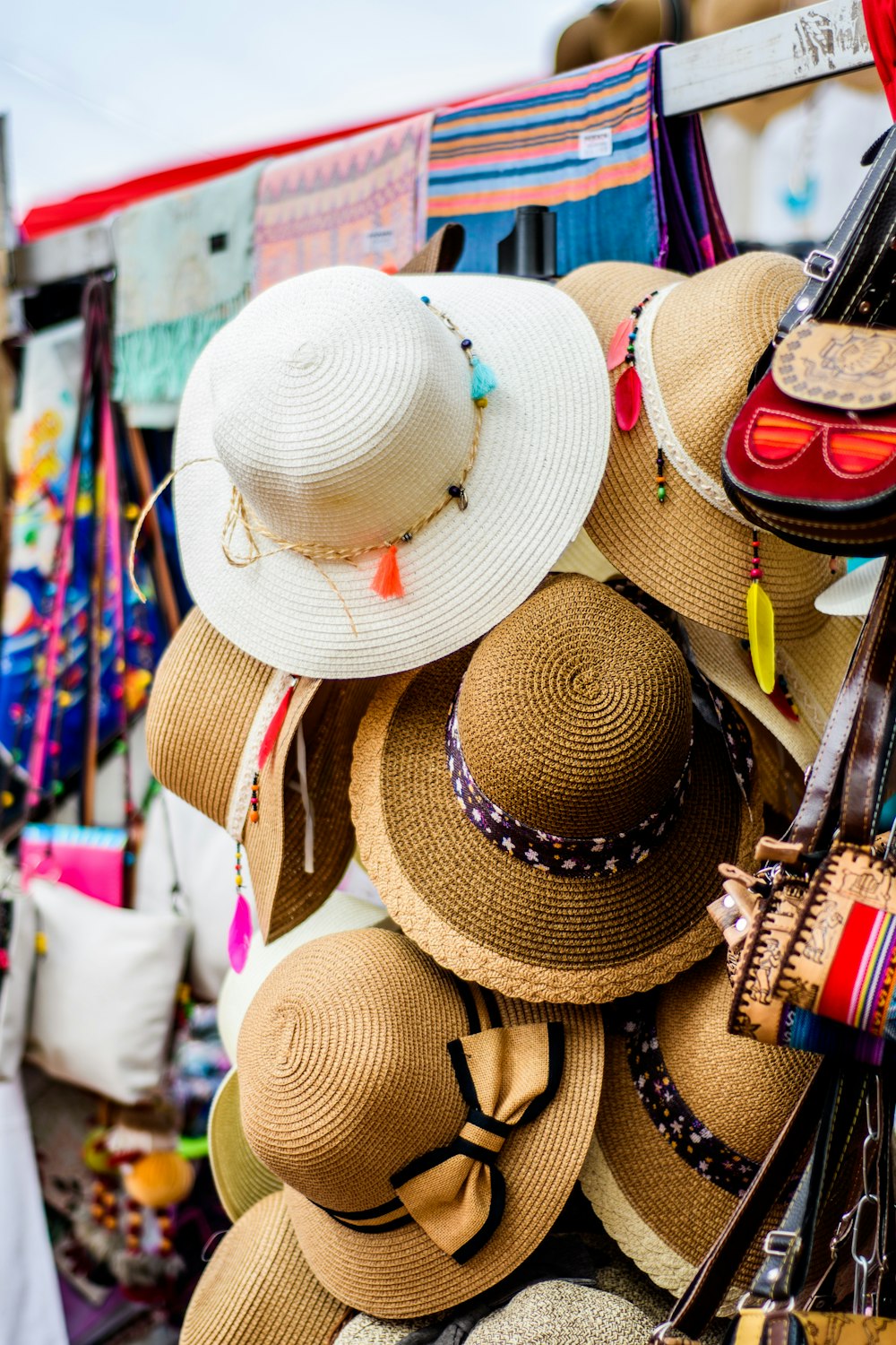 assorted brown and white sun hat display during daytime