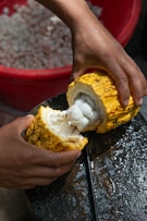 person splitting fruit