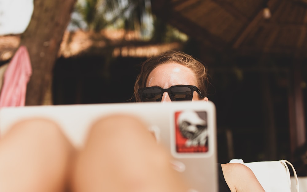 woman wearing black framed sunglasses