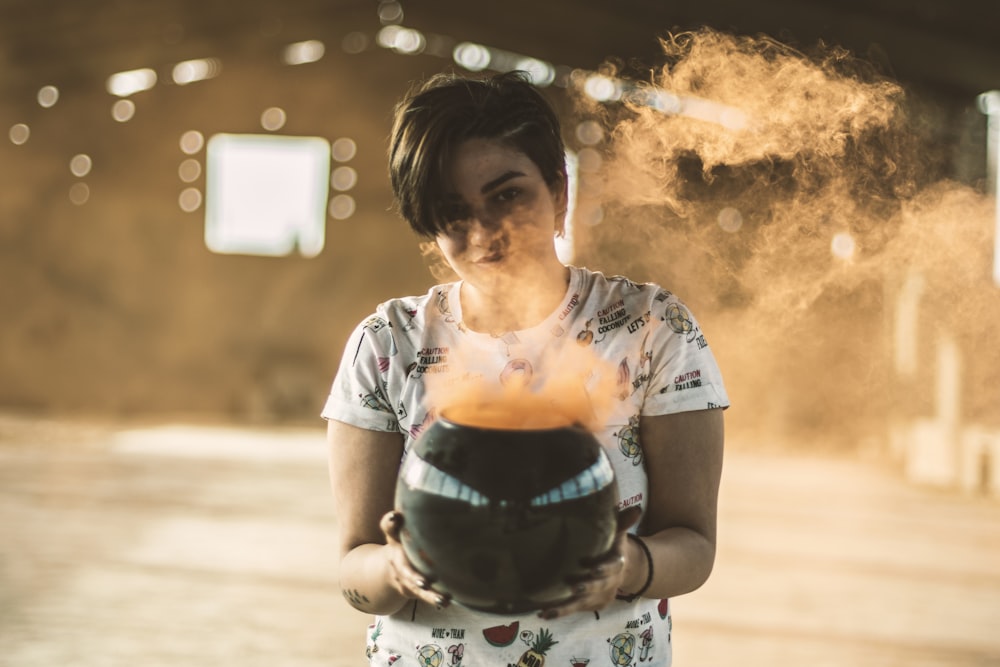 woman holding black bowl