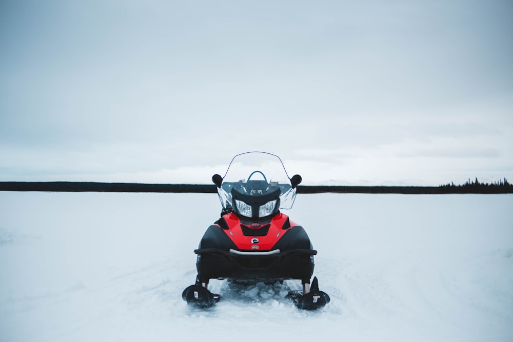 black and red snowmobile