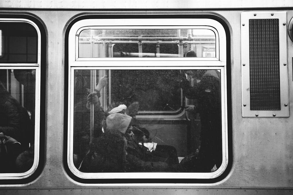 people inside gray train