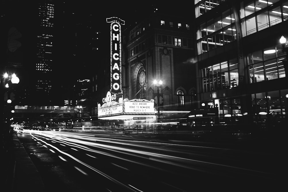 grayscale photo of city street at night