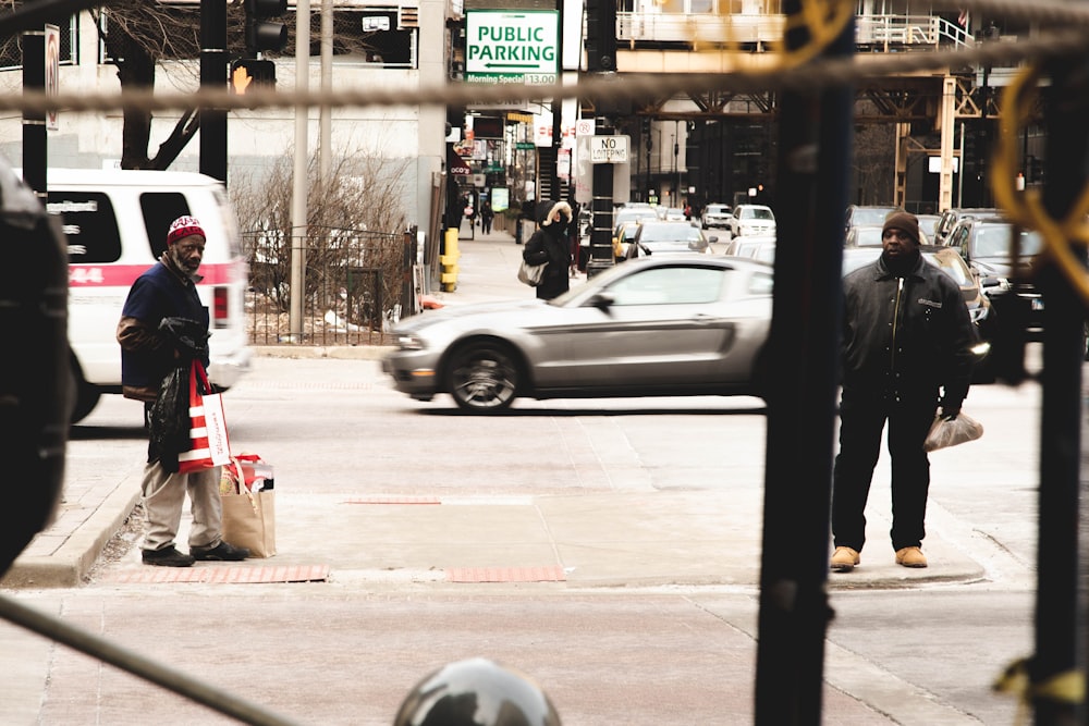 man standing in street during daytime