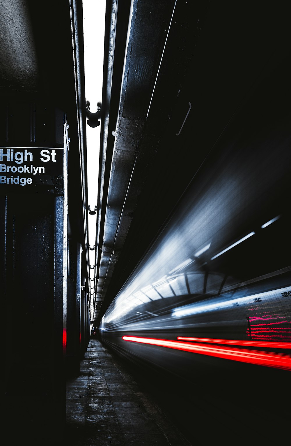 time lapse photography of train passing by on station