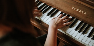 woman playing Yamaha piano