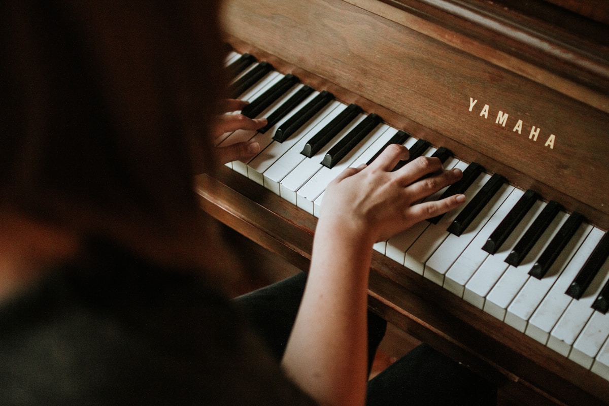 Pianist hands on keyboard in focused practice